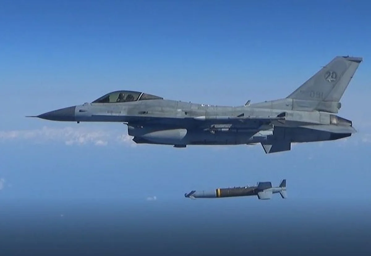 A South Korean Air Force's F-15K fires an air-to-surface missile towards the north of the maritime border with North Korea, in this handout provided by South Korea's Defence Ministry on November 2, 2022.