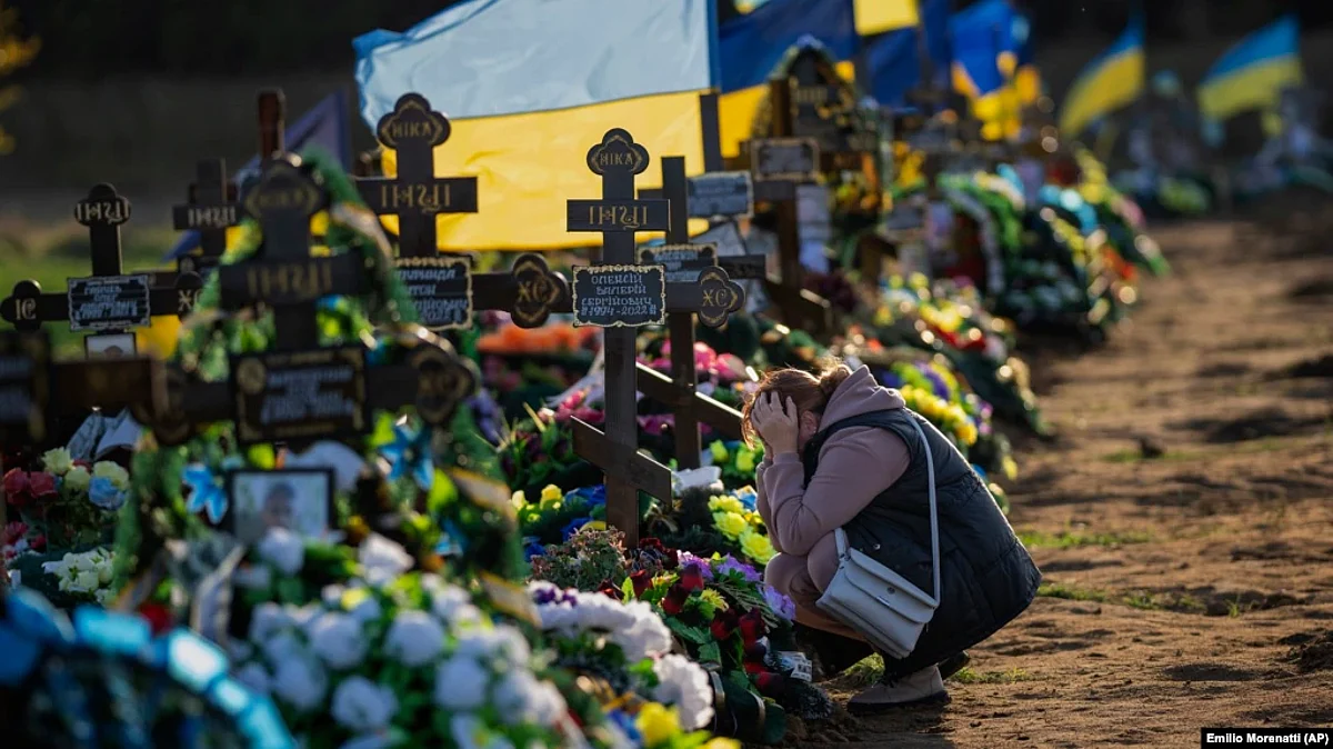 Tamara, 50, mourns at the grave of her only son, a Ukrainian soldier killed during a Russian bombing raid, at a cemetery in Mykolayiv on October 26. (AP)