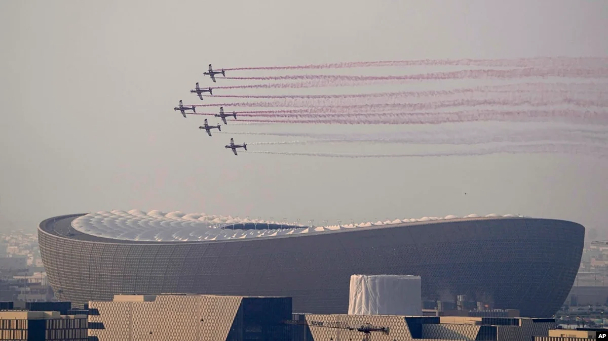 A flypast of takes place over the Lusail Stadium in Lusail, Qatar, where the World Cup final soccer match between Argentina and France is going to be played on Dec. 18, 2022. (AP)