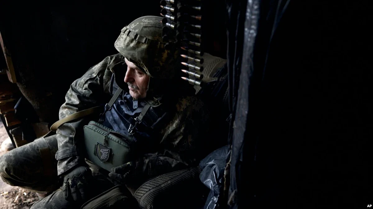 A Ukrainian soldier sits in his position during fights with Russian forces near Maryinka, Donetsk region, Ukraine, Dec. 23, 2022. (AP)