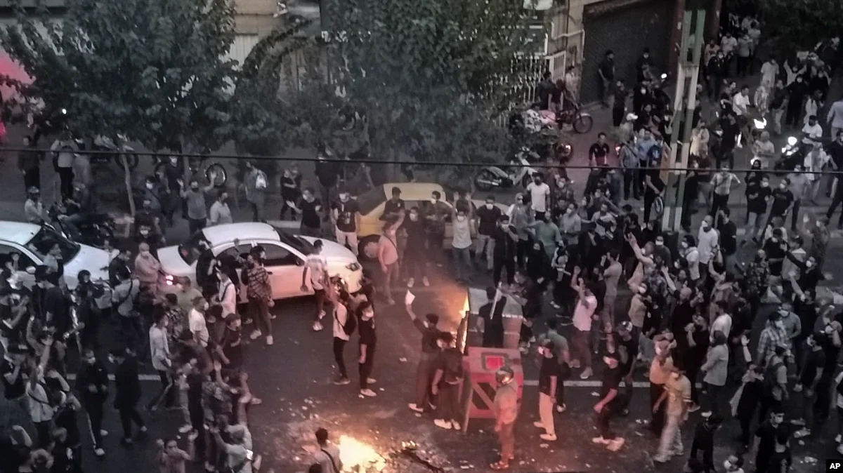 Iranians protest Mahsa Amini's death after she was detained by the morality police, in Tehran, Sept. 20, 2022. (AP)