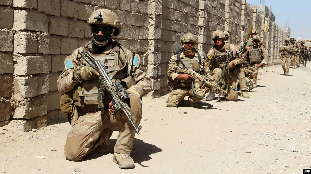 Afghan National Army commandos take position during a military operation in Helmand Province in October 2016. (AFP/RFE)