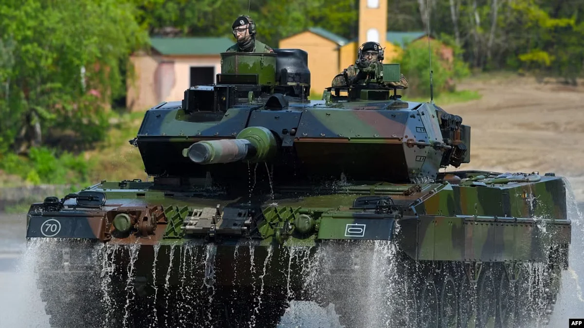 FILE - This photo taken May 20, 2019, shows soldiers on a Leopard 2 A7 main battle tank of the German armed forces Bundeswehr driving at a military training area in Munster, northern Germany. (AFP)