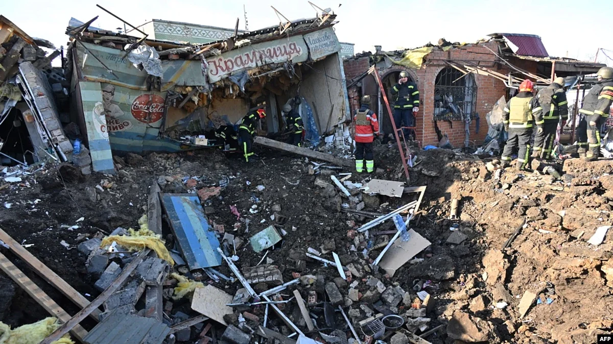 Ukrainian rescuers work on the site following a Russian missile strike on a local market in Shevchenkove village, Kharkiv region, Jan. 9, 2023. (AFP)