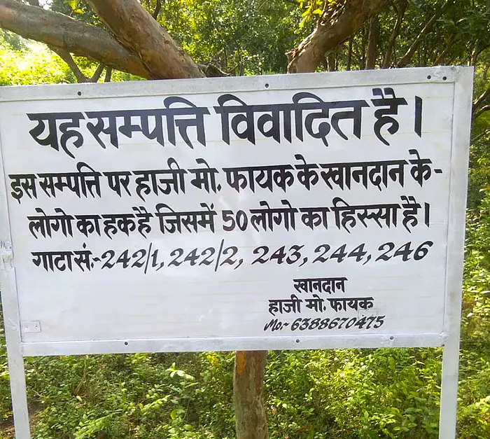 ‘This is a disputed property,' proclaims a signboard on the land that was recently uprooted.