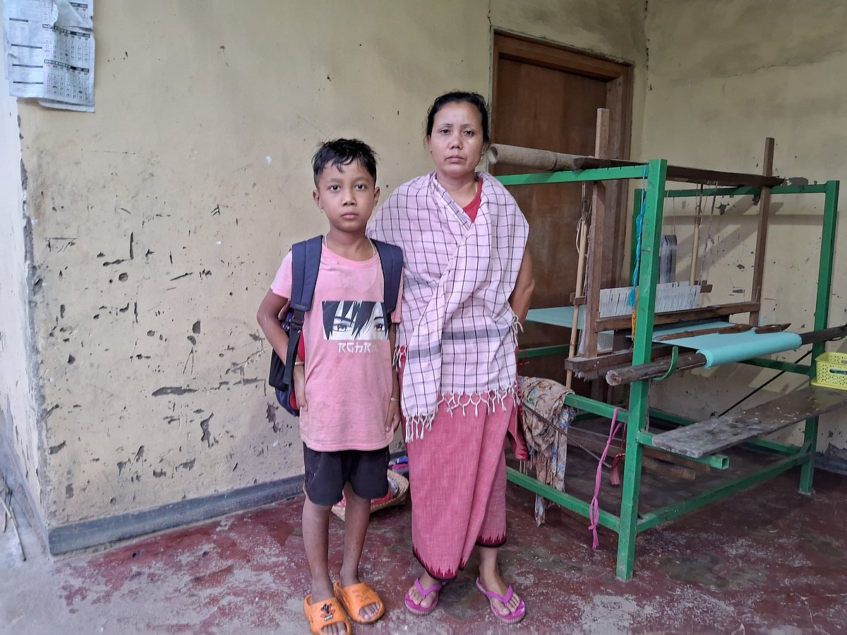 Ranjita Soibum with her son at her house in Imphal. She is still waiting for her husband's body.