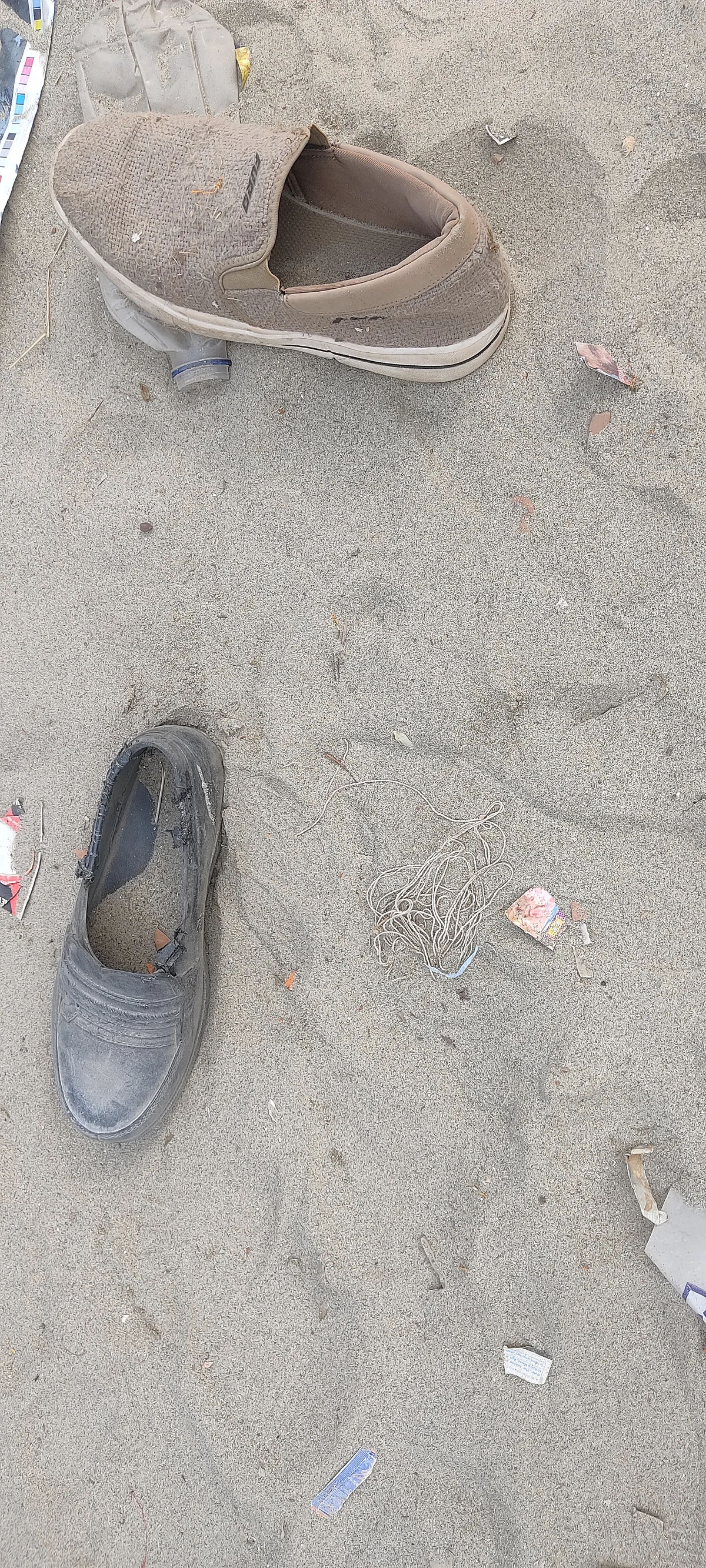 Shoes left behind near Sangam Ghat.