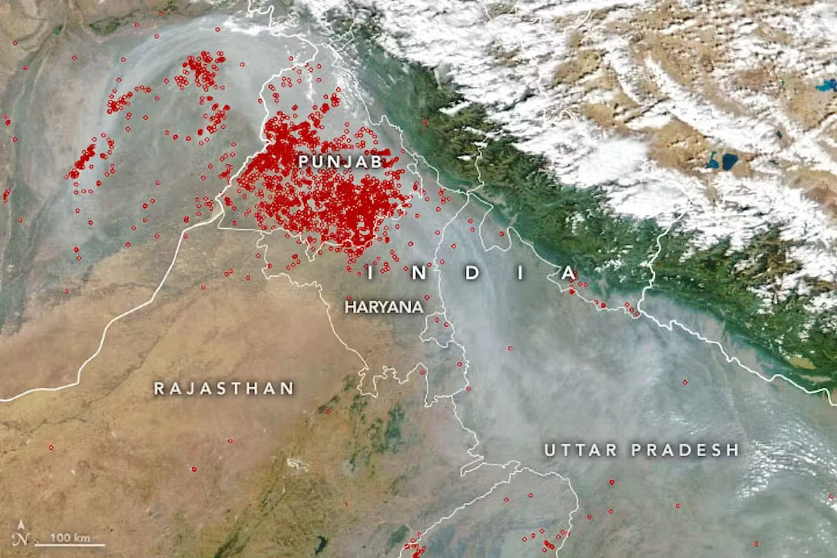 Satellite map showing smoky skies over northern India in November 2022 (Delhi is the small unlabelled region between Haryana and Uttar Pradesh). The red images show fires started by farmers to clear away unwanted crop residue. This ‘stubble burning’ is a big source of pollution downwind in Delhi. | NASA