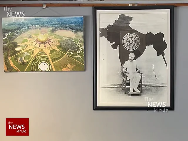 A framed picture (right) on a wall in Bharat Nivas shows The Mother sitting in front of an undivided India map.