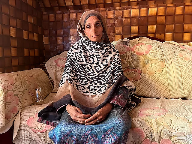 Iqbal’s wife, Naseemat, at their home in Kashmir.
