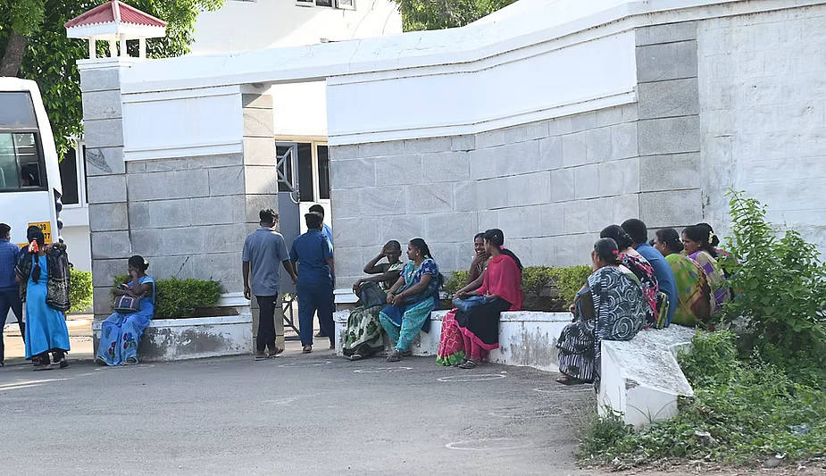Workers commute to their place of work on buses arranged for by the mill’s management in Dindigul in Tamil Nadu. 