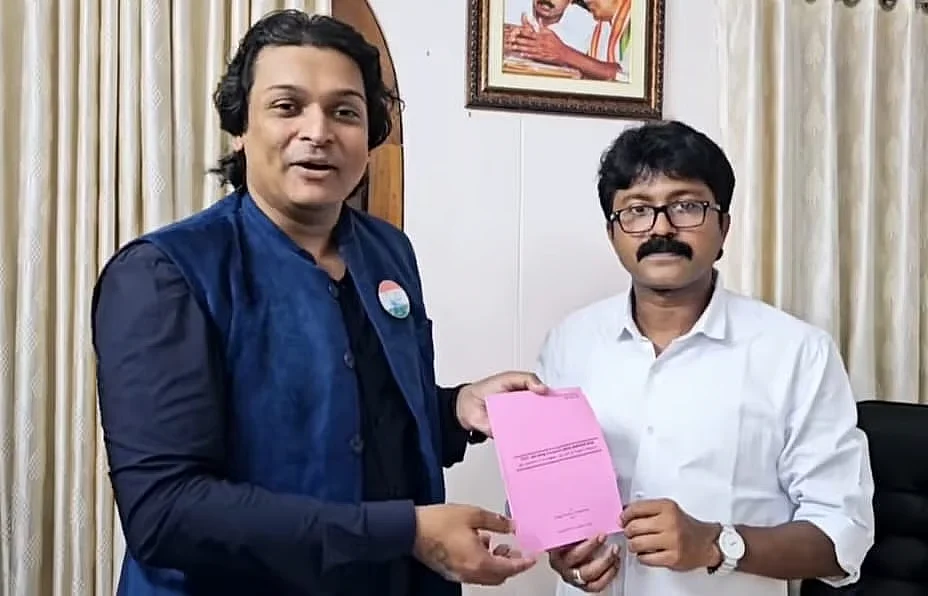 Rahul Easwar hands over the Men's Commission draft bill to Eldhose Kunnappilly MLA