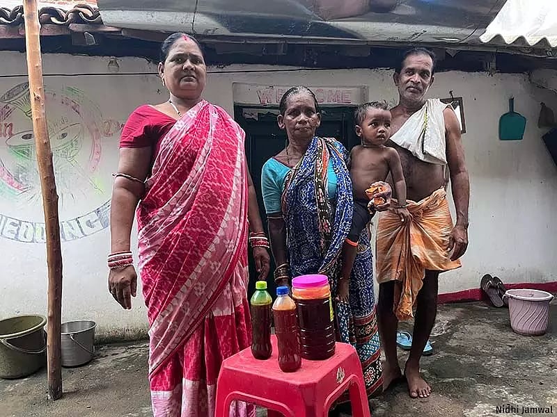 Adivasi villagers collect and sell forest honey from the Gandhamardhan Hills, which they consider sacred.