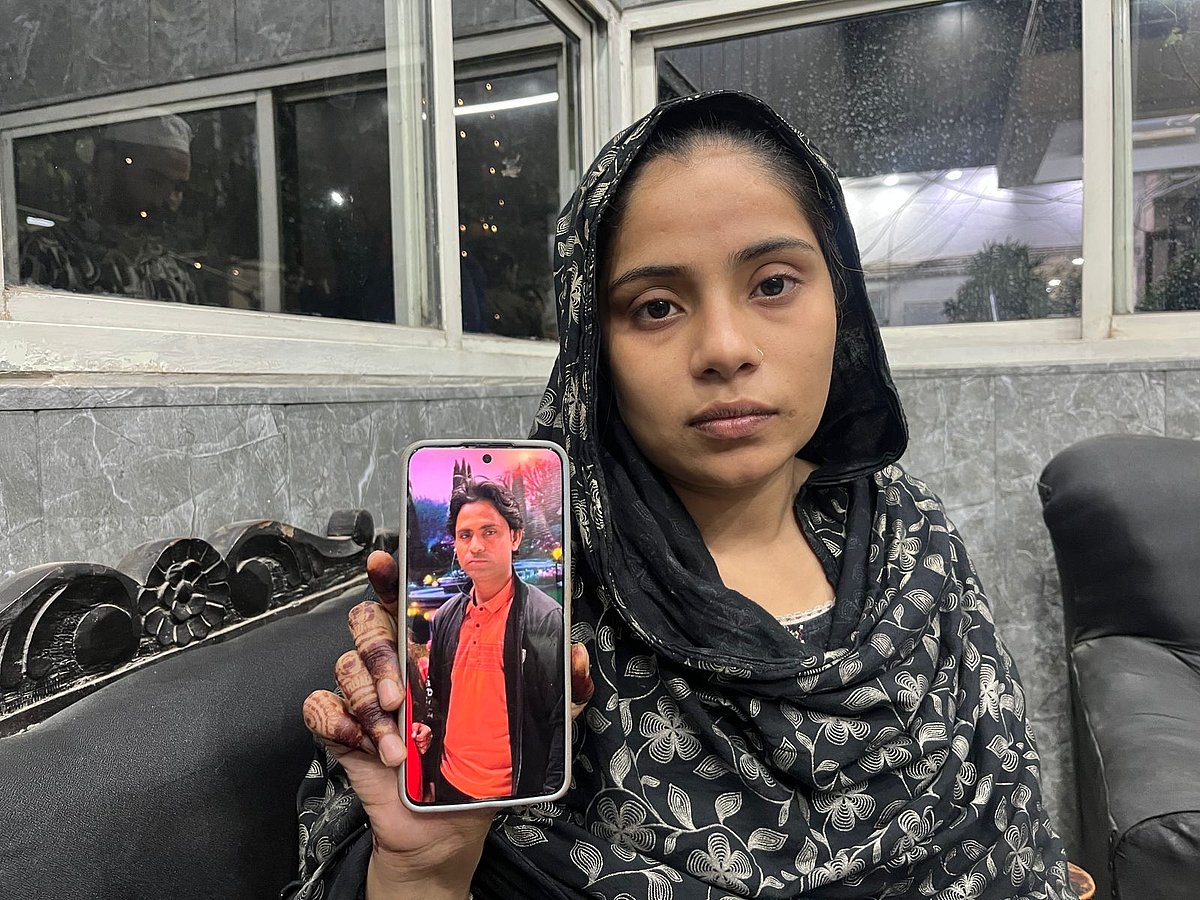 Nazish with a picture of Mohsin.