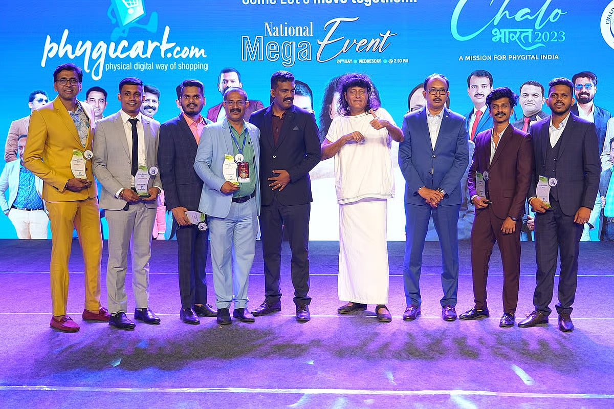 Boby Chemmanur flanked by Anish Joy on the left and Antony Jolly on the right in one of their events.