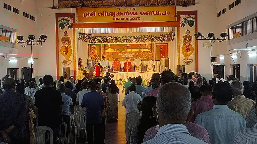 Participants gather inside a hall during a Hindu Ekta Sammelanam in Edappally