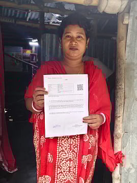 Bishnupriya Majumdar, a homemaker in North 24 Parganas, shows her SIR hearing notice. After discovering that her name was removed from the voter rolls, she says she is unsure of how the appeals process works or how to proceed. (Image courtesy Kainat Sarfaraz)