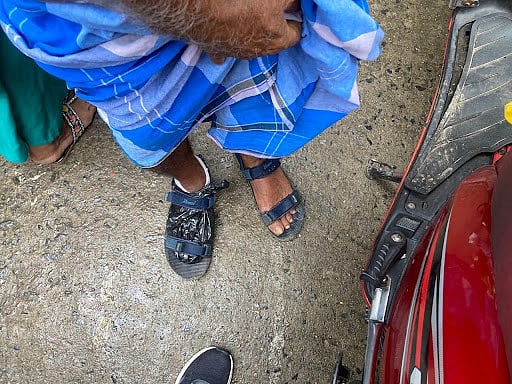 Mohammed Hadis showing his severely diabetic foot, wrapped in polythene. (Image courtesy Suhasini Biswas)