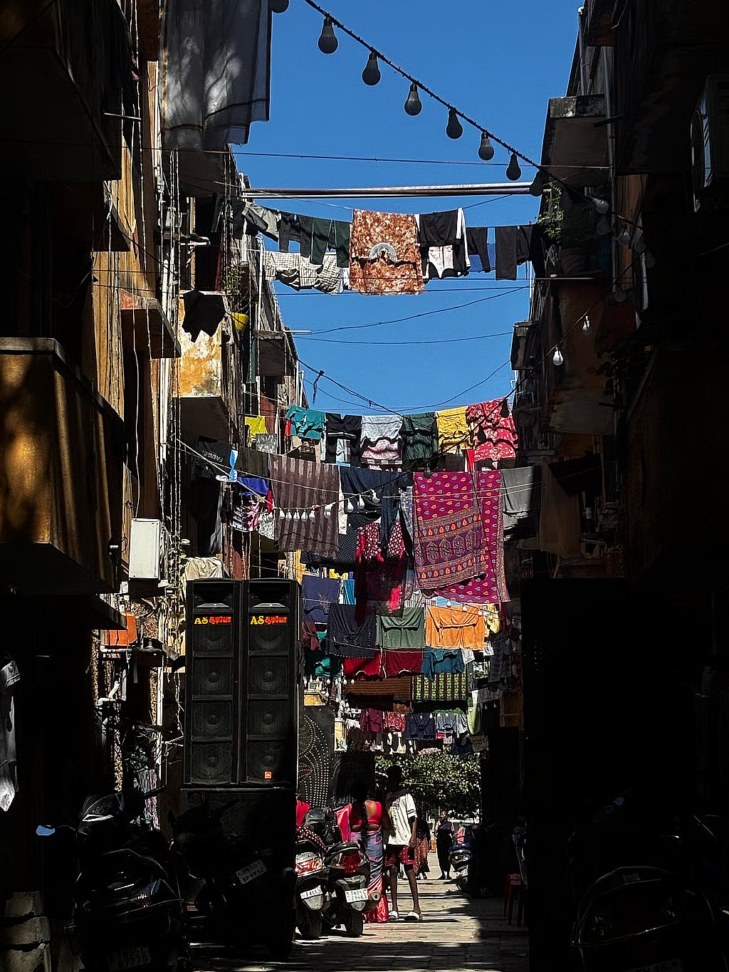 A narrow lane in SM Nagar, Perambur, where closely packed housing and limited civic infrastructure shape daily life.