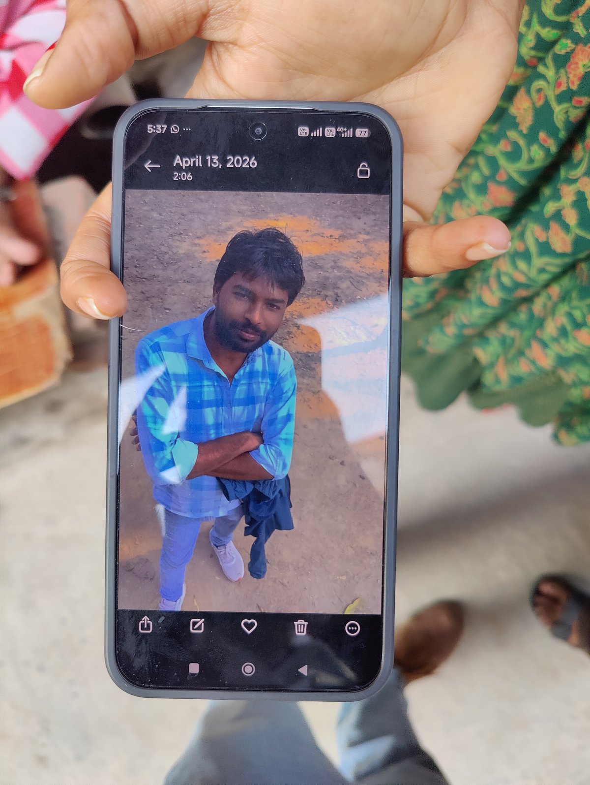 Divya showing us a photo of Kamlesh. 