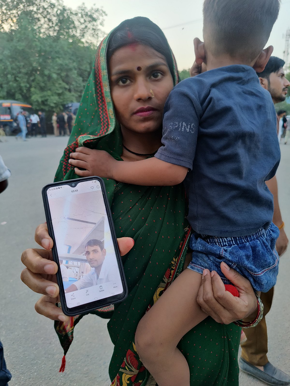 Sita is showing us a photo of her husband, Jitendar Kumar.  
