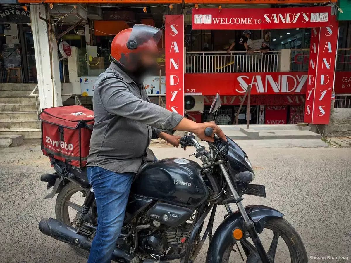 Thirty-year-old Rinku Kumar (name changed) earns an incentive of Rs 233 for completing 22 orders in a day. “It is not possible to take a two- or three-hour break during a heatwave under company policy. If I take a break, I won't earn enough.” (Image courtesy Shivam Bhardwaj)
