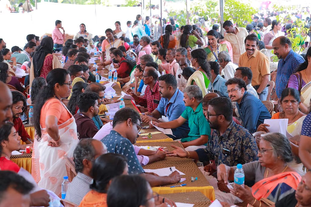 People gather at a Nava Kerala Sadas grievance redressal programme organised by the LDF government. The statewide outreach initiative was projected as a direct engagement exercise between the government and the public, though it later attracted political criticism over its optics and handling of protests.