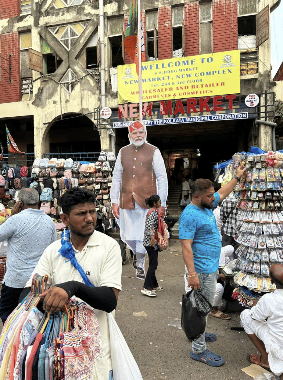 New Market: Supporters of the BJP, celebrating their victory, brought a bulldozer in. A TMC office was torn down. Central forces and city police stood nearby, watching in silence.