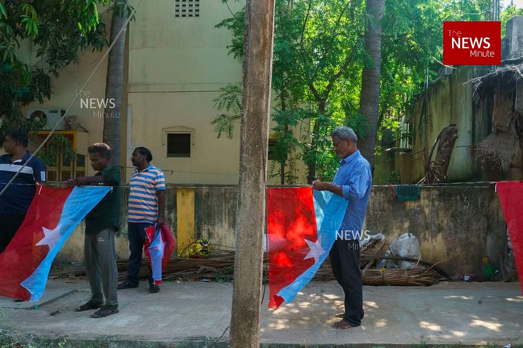 VCK party workers tying VCK flags ahead of the elections