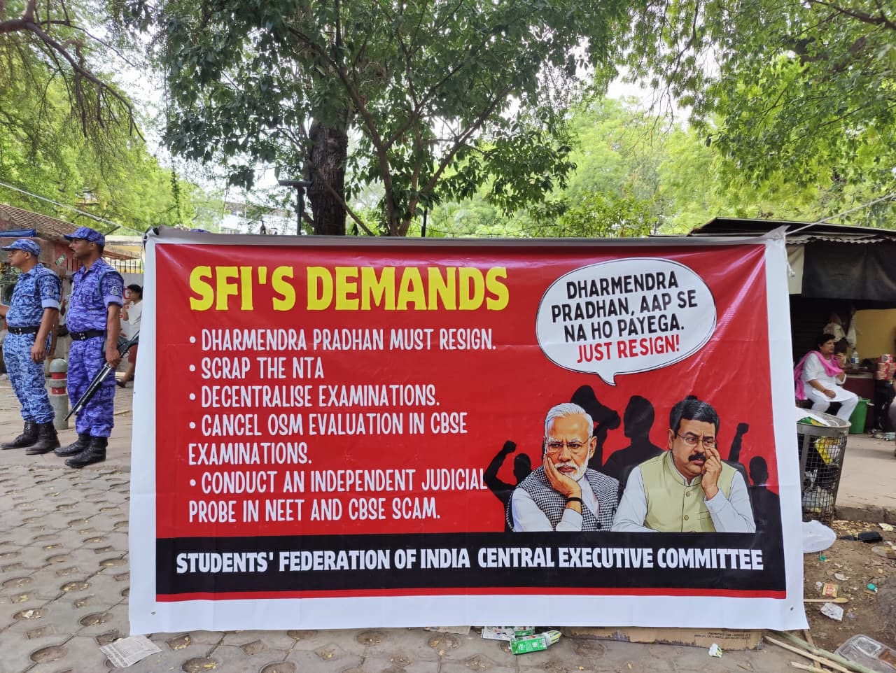 A poster highlighting SFI's demands at the CJP protest