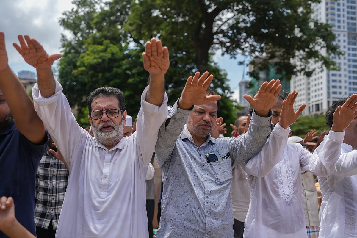 People offer "Namaz-e-Istasqa" a special prayer for rains in Mumbai, India. (AP Photo/Rafiq Maqbool)