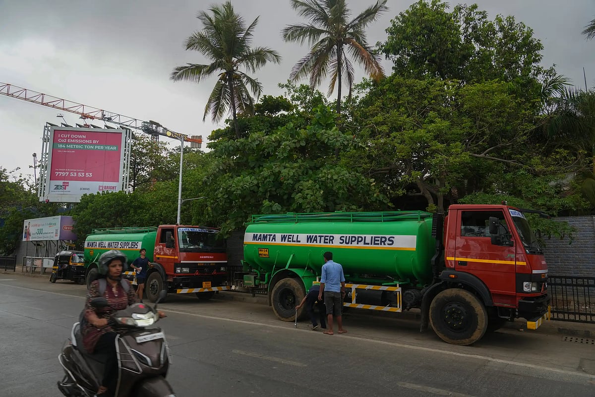 Water tankers are seen outside a construction site in Mumbai. (AP Photo/Rafiq Maqbool)