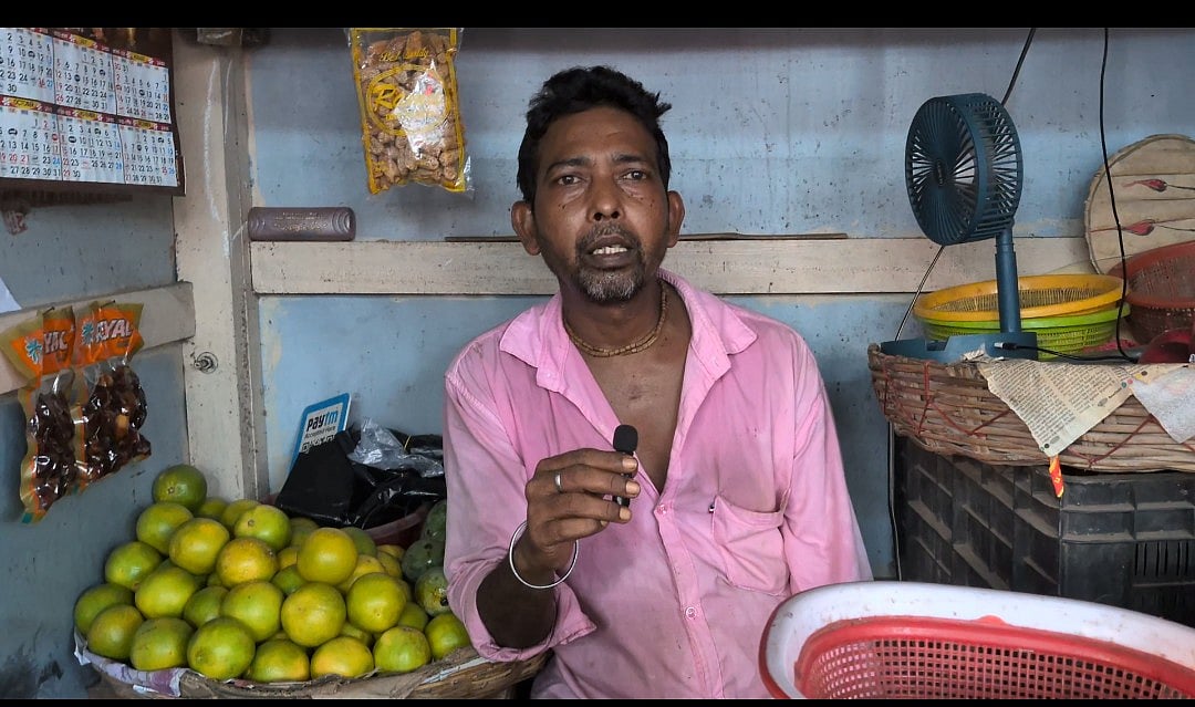 Tapas Chaudhury sells fruits in a makeshift stall. (Image courtesy Chenab Guha)