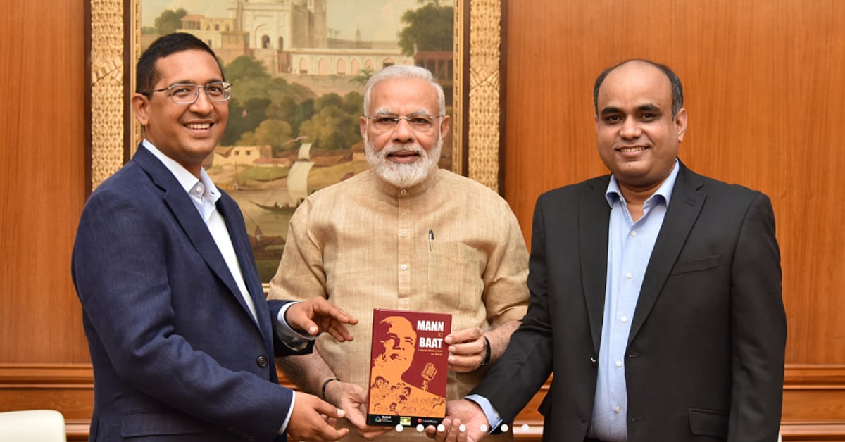Akhilesh Mishra and Hitesh Jain with PM Modi. 