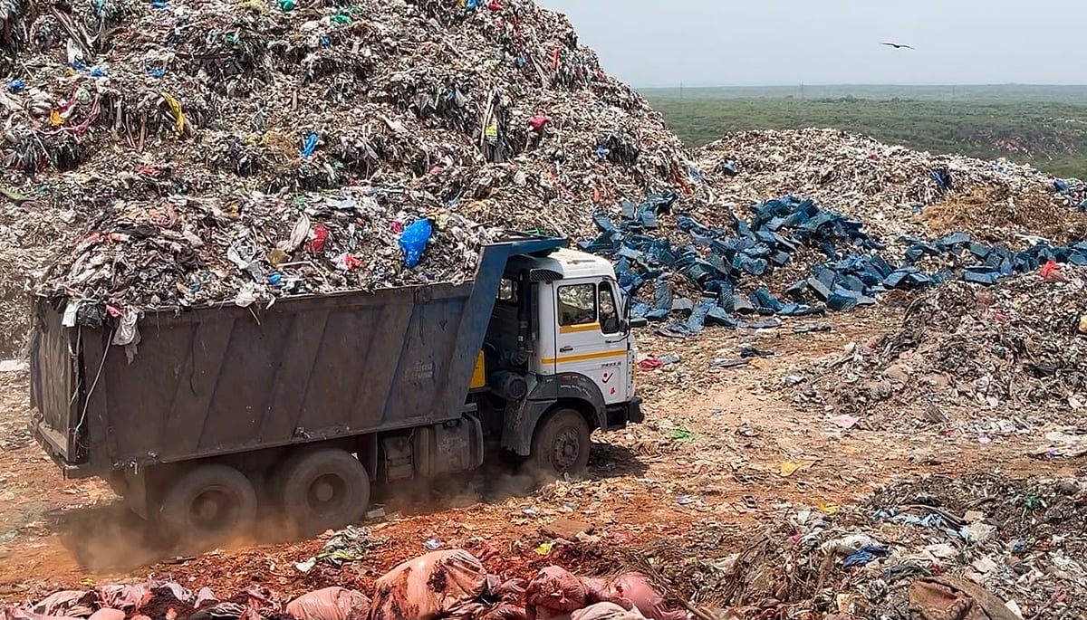 Garbage truck carrying unsegregated waste at Bandhwari