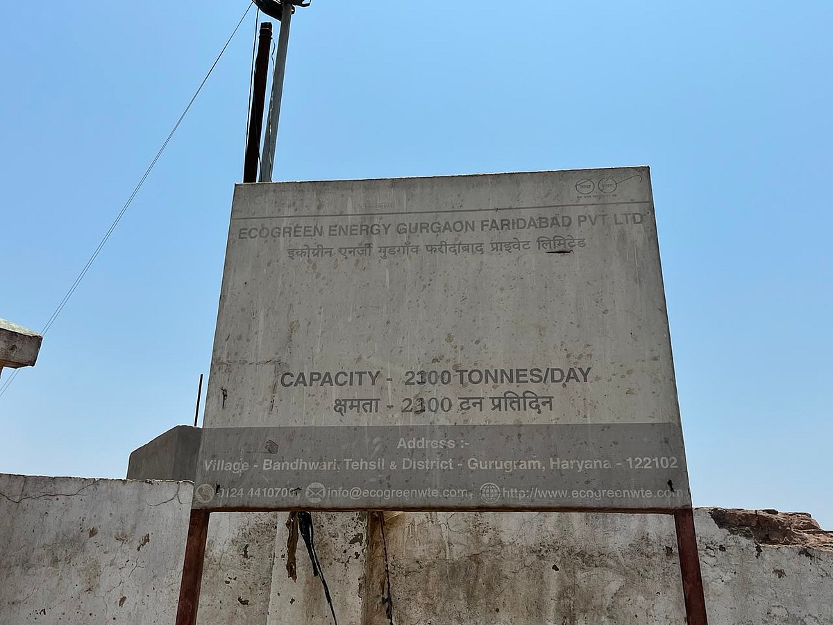 Ecogreen board outside Bandhwari landfill