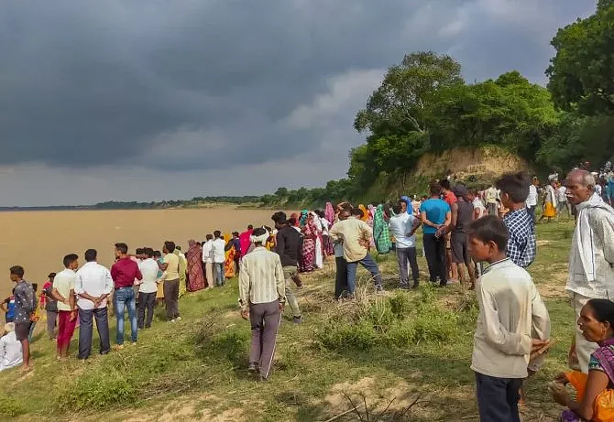 People gather as rescue operations are underway after a boat capsized in UP | Image: PTI
