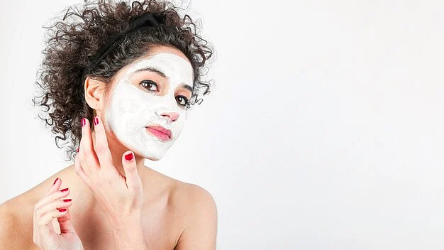 beautiful young woman applying cosmetic cream her face23 2147901155