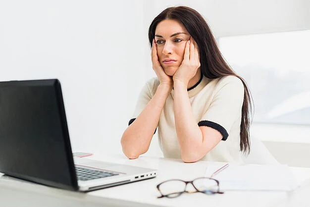 bored woman sitting table with laptop 23 2148056169