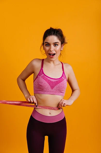 white young woman measuring her waiste197531 13137