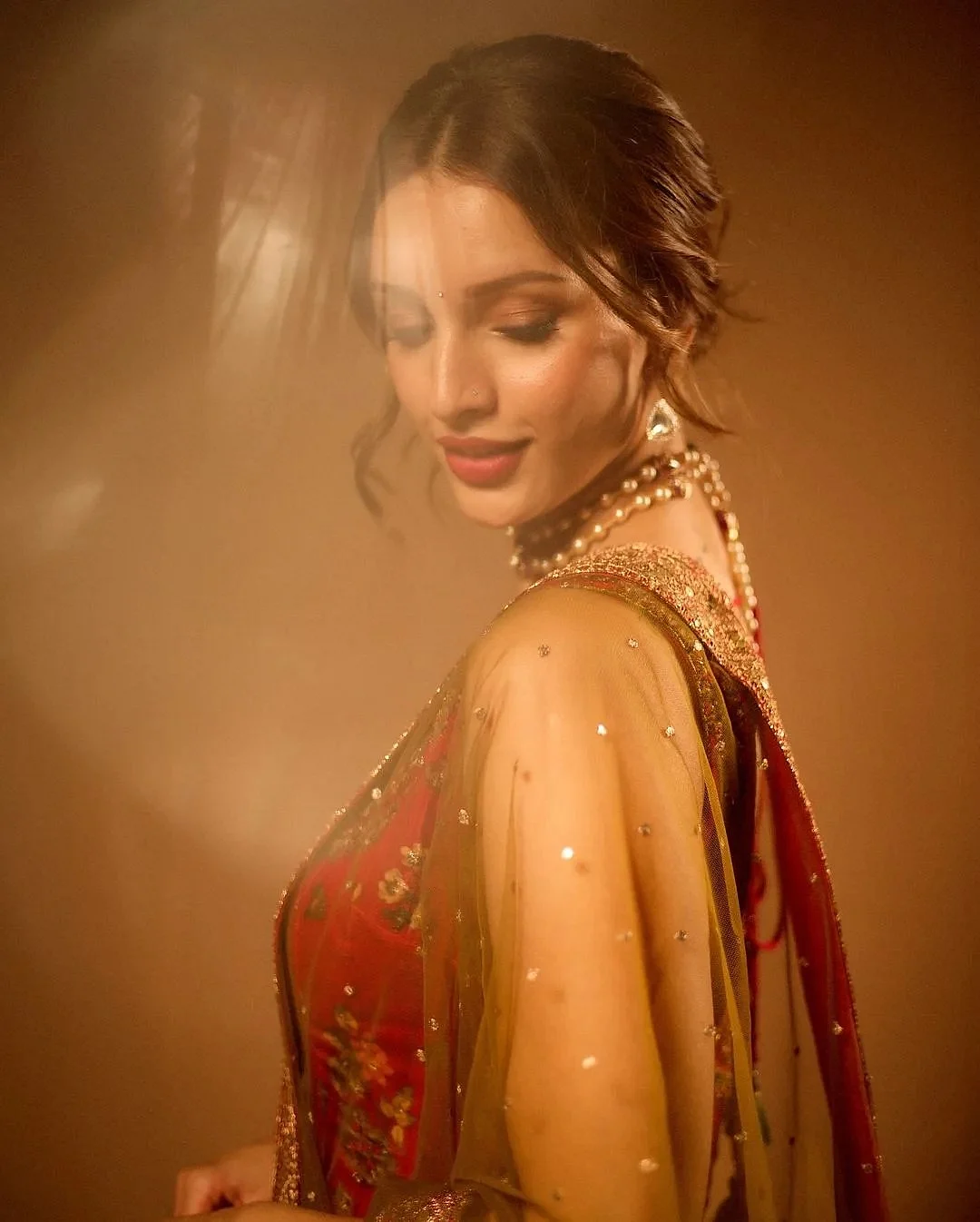 tripti dimri in red suit