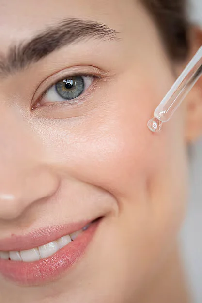 portrait beautiful woman with clear skin using face serum23 2149207916