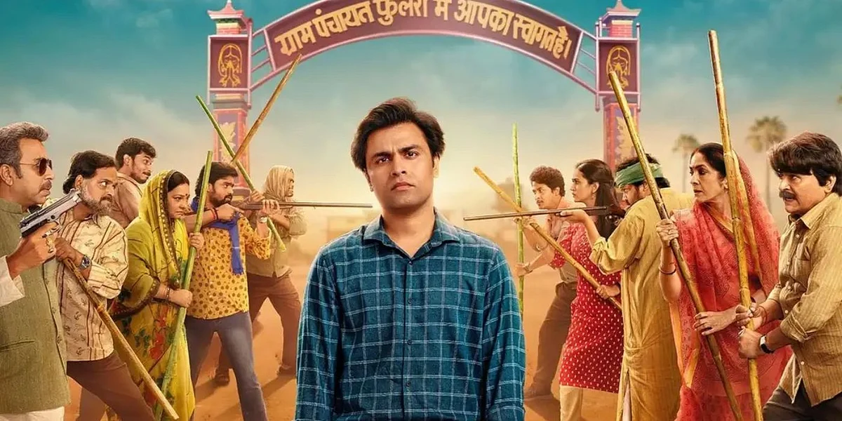 jitendra kumar as abhishek tripathi standing in front of a group of villagers about to fight in panchayat