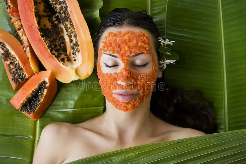 beautiful woman having fresh papaya facial mask apply fresh pap caucasian natural skin care wellness outdoors vitamin 55779074