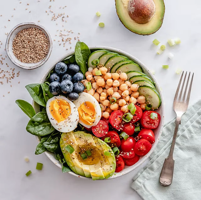 buddha bowl with avocado egg chickpeas tomato royalty free image 1704305837