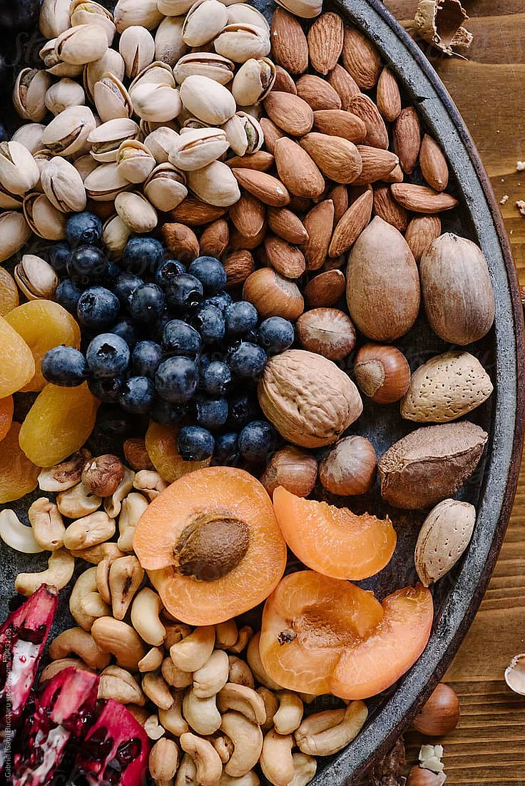 Fruit And Nuts Platter by Stocksy Contributor Gabi Bucataru
