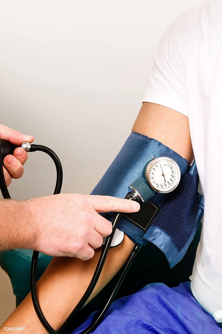 Download free image of Female clinician in the process of conducting a blood pressure e