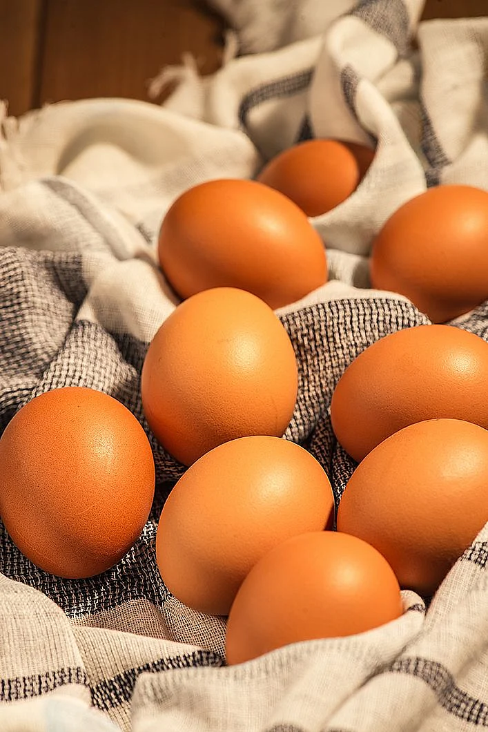 Стоковая фотография 1321706324 Eggs Towel On Wooden Table Shutterstock