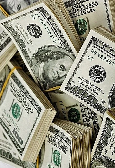 Many bundle of US 100 dollars bank notes