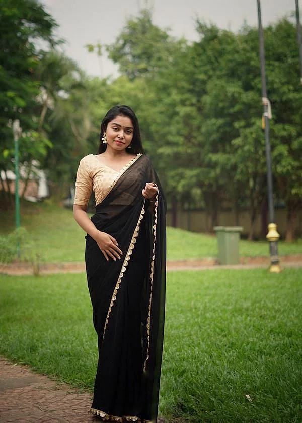 blak saree golden blouse